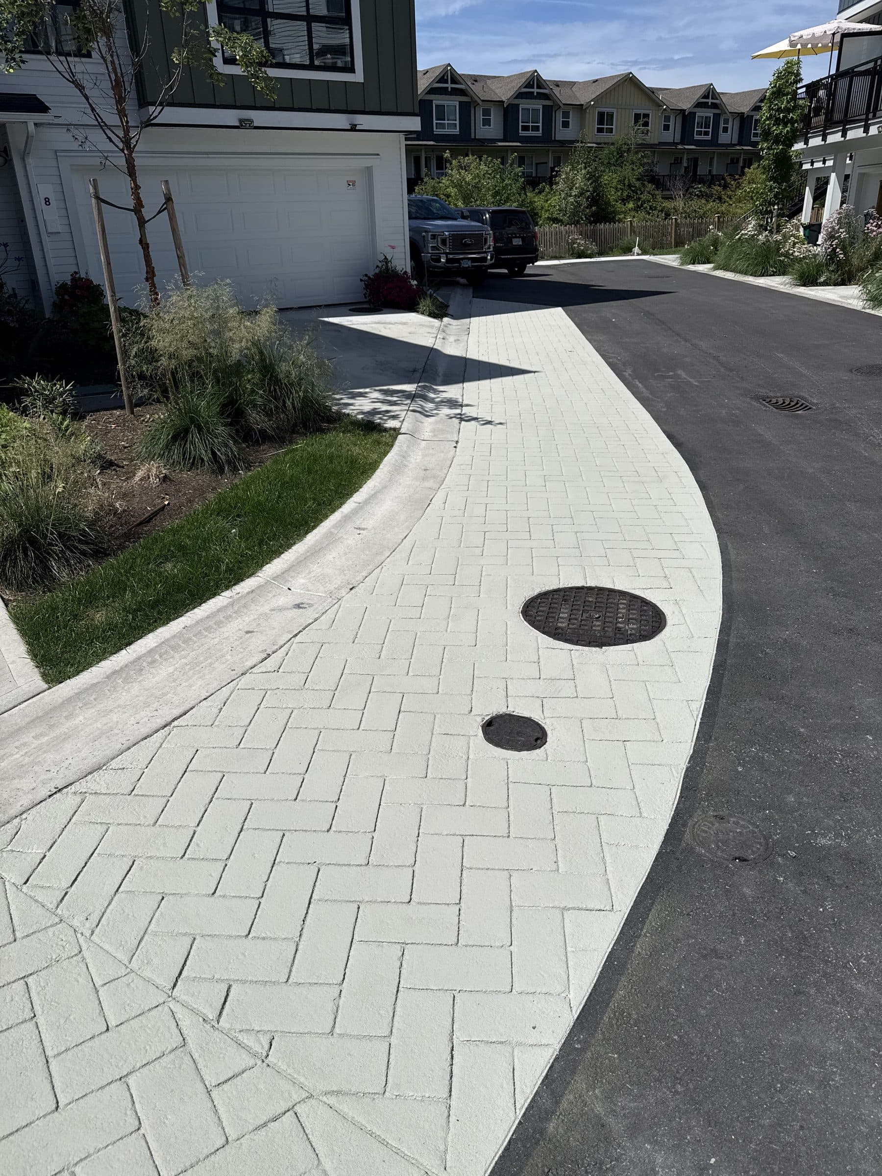 Herringbone driveway and walk in StreetPrint — Lower Mainland, BC. Installed by Square One Paving.