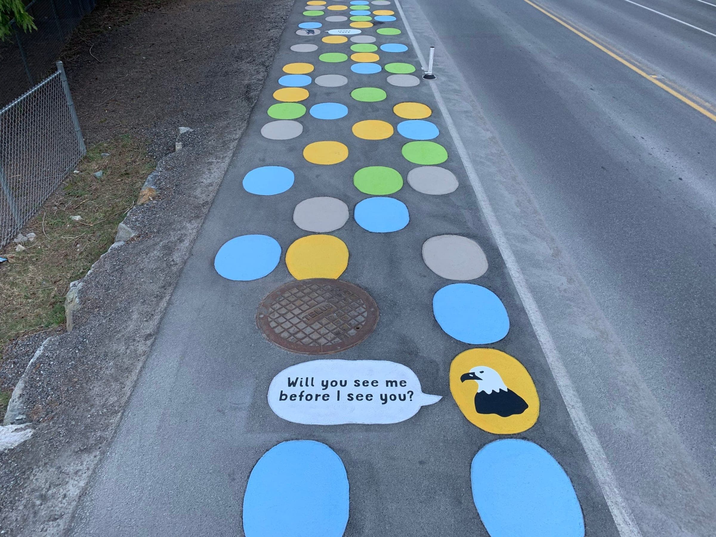 Polka-dot StreetBond walkway along a road on Bowen Island