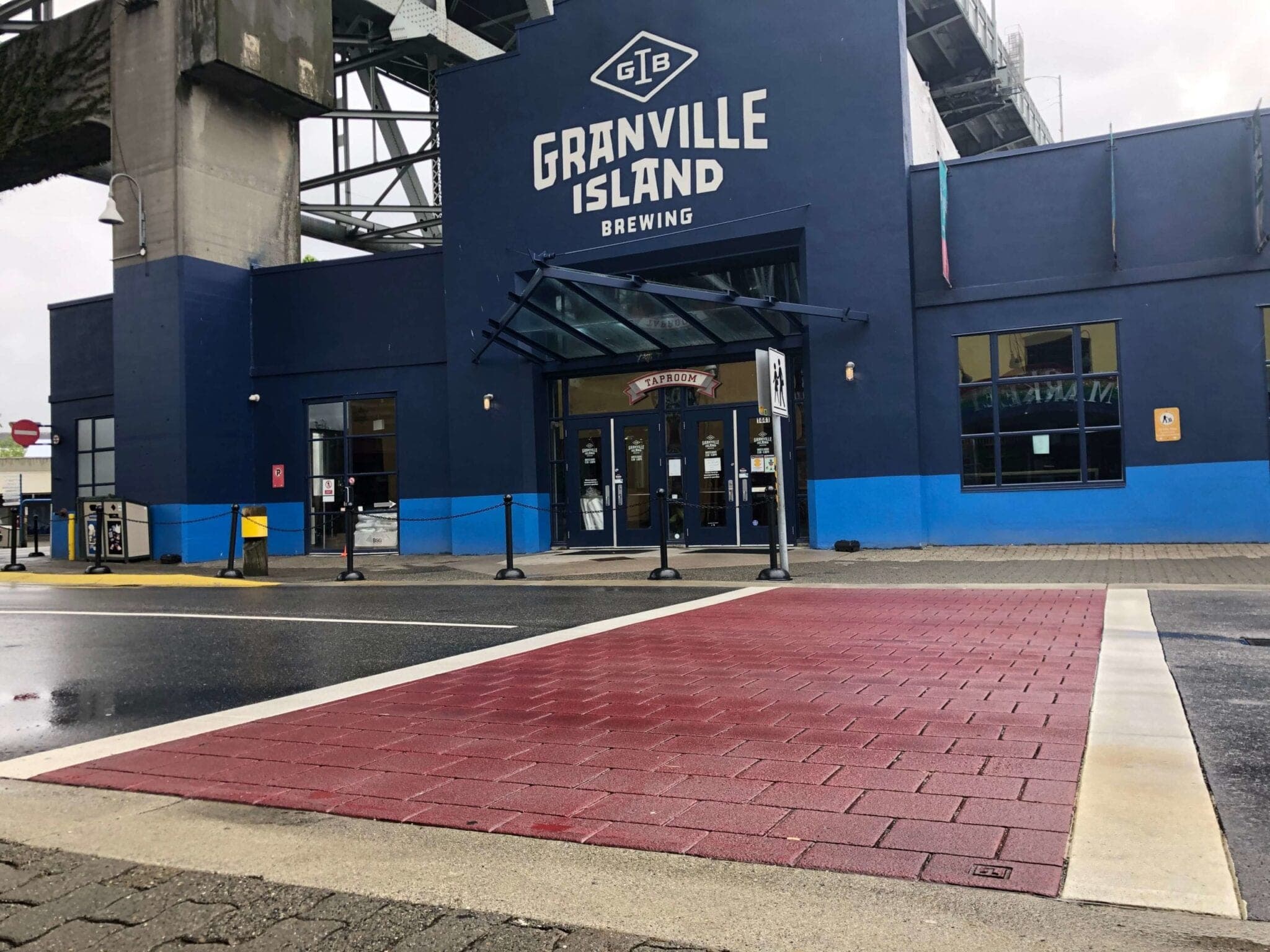 Brick-red TrafficPatternsXD crosswalk outside Granville Island Brewing, Vancouver